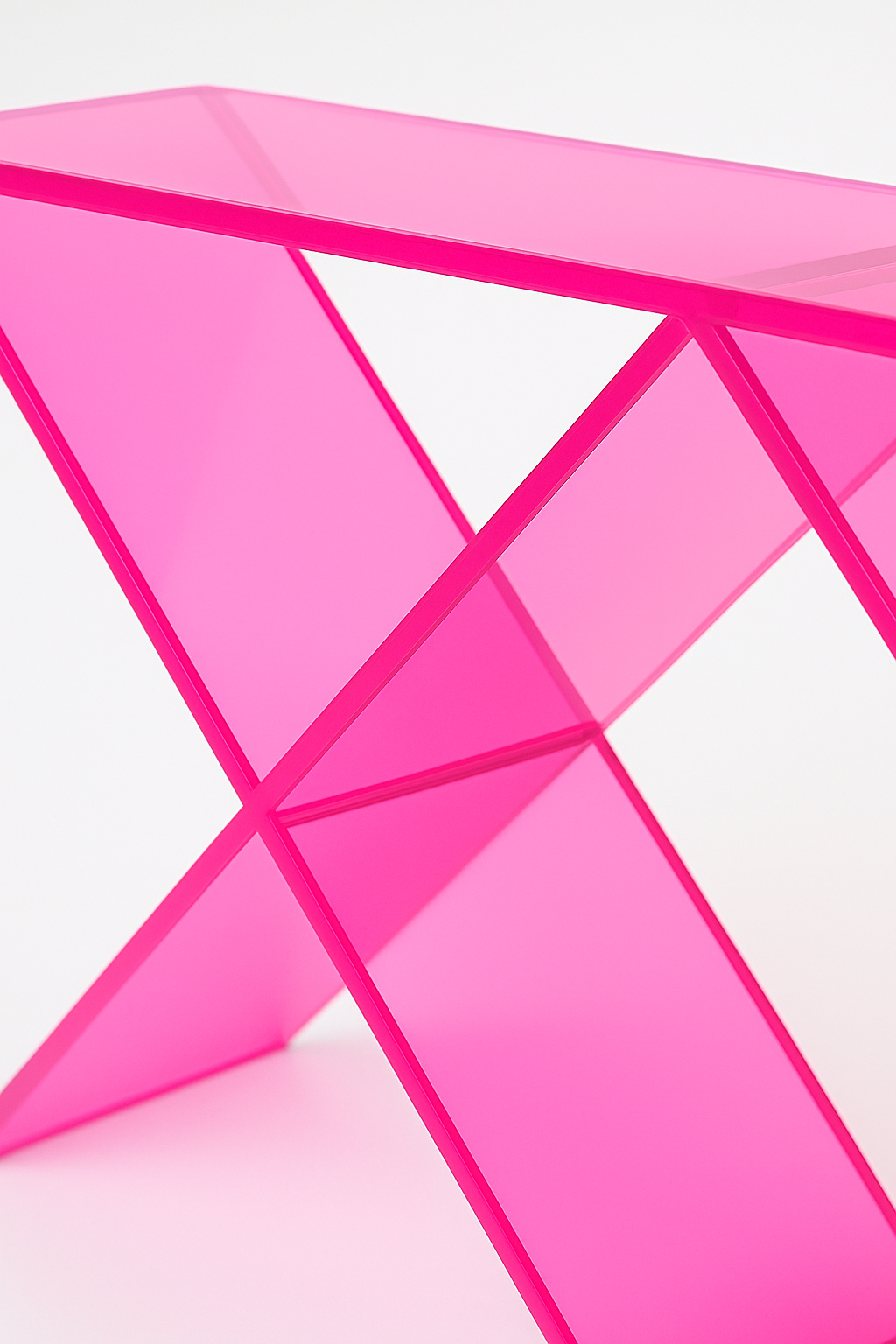 Close-up view of the Acrylic X Console Table Neon Pink highlighting the unique X-shaped base design, ideal for a bold acrylic console table.