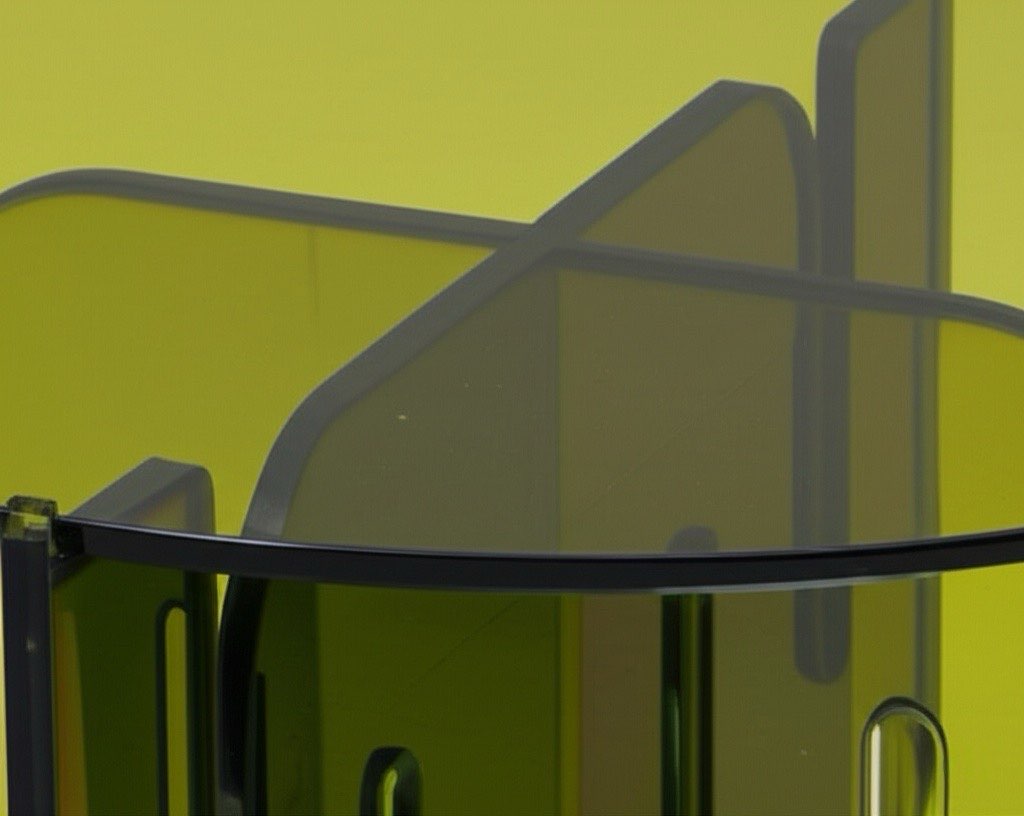 Lifestyle image featuring the Olive Oil Wave Lucite Table with decorative accents, illustrating its versatility in modern home decor.